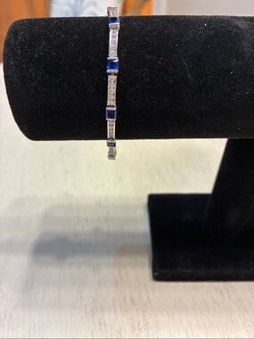 SilverBracelet with lab grown Sapphire and CZ. Has 925 stamp
Which is Sterling.